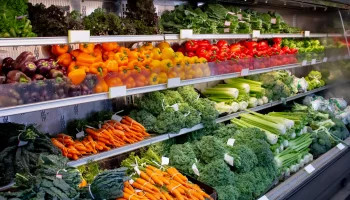 A view of a fresh vegetable display at a local grocery store.